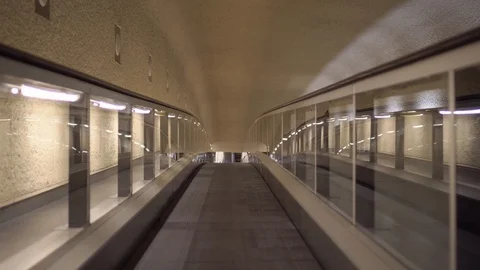 Smooth forward movement on a horizontal escalator, in the lobby of the airport Stock Footage 121878362