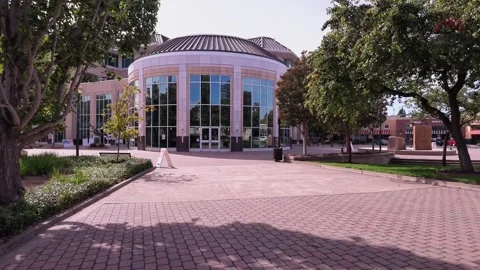 Smooth forward tracking shot revealing the contemporary architecture of the Видео 344951502
