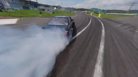 Smooth FPV Drone Chase of Black Solo Drift Car with Heavy Tire Smoke 库存影片 336198729