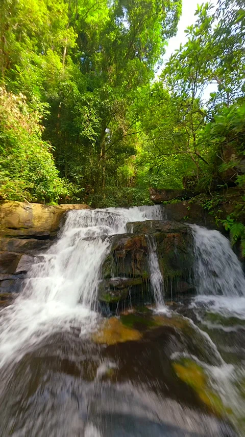 Smooth FPV flight over cascading river in a tropical rainforest in Thailand. Stock Footage 276703694