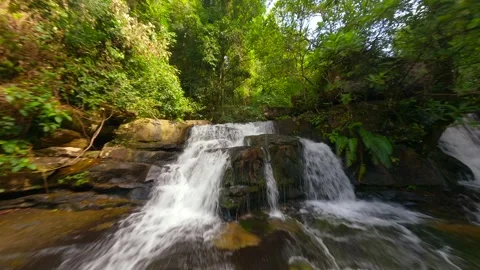 Smooth FPV flight over cascading river in a tropical rainforest in Thailand. Stock Footage 276903358