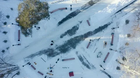 Smooth geometry of park paths and benches, a view from the throne of winter Video stock 171289346