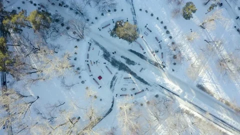 Smooth geometry of park paths and benches, a view from the throne of winter park Stock Footage 171289406