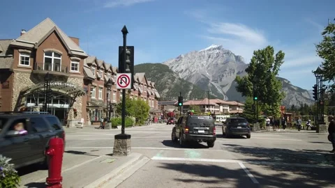 Smooth Gimbal Drive Through Banff Village During Summer Day Stock Footage 130861396