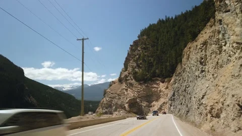 Smooth Gimbal Rock Wall Driving on Highway of Yoho National Park Video stock 130861769