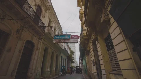 Smooth gimbal shot of walking through the streets of havana looking up Stock Footage 88763310