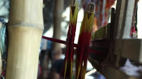 Smooth glide side tracking shot of traditional loom in Indian village Stock Footage 49911104
