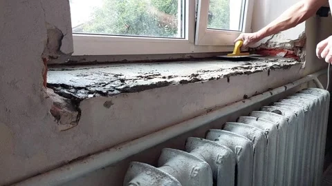 Smooth Glue Application: Precision Leveling on Windowsill Video stock 311228990