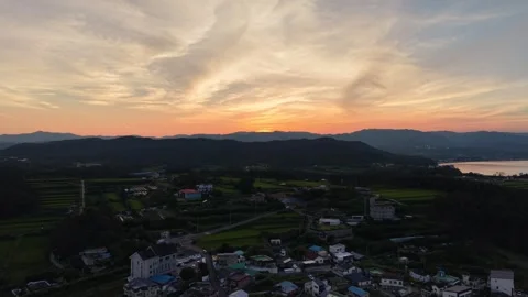 Smooth Golden Sunset over Coastal Village and Mountains in South Korea Stock Footage 344778583