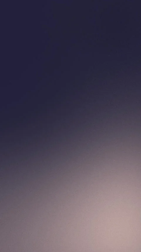 Smooth gradient with dark purple and soft beige tones. Seamless loop background. Stockbeeldmateriaal 309956433