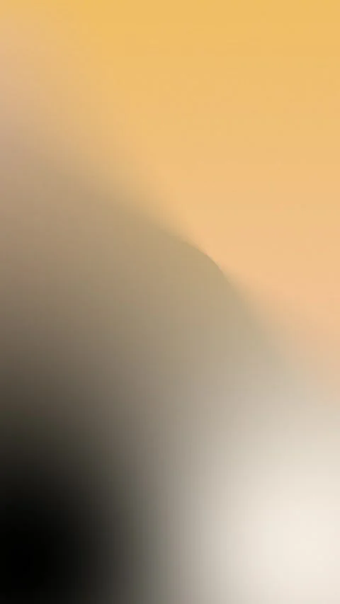 Smooth gradient seamless loop background in shades of black, beige, and amber. 動画素材 309856154