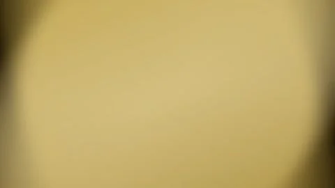 A smooth gradient surface featuring a warm and elegant golden light texture Stock Footage 335145777