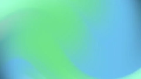 A smooth gradient transitions from green hues to shades of blue Stock Footage 294661758
