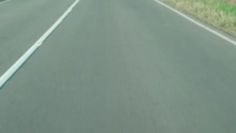 Smooth gray asphalt road surface with motion blur and lines. Stock Footage 342443048