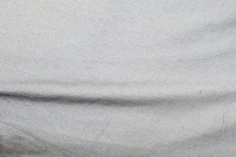 Smooth gray fabric texture with subtle wrinkles, ideal for backgrounds and Stock Photos