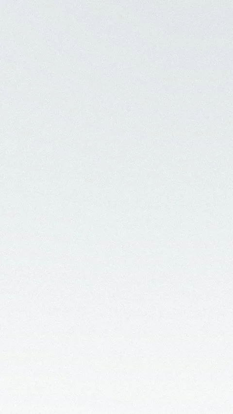 Smooth gray gradient with subtle grain texture. Seamless loop background. 4K. Vídeo Stock 309956645