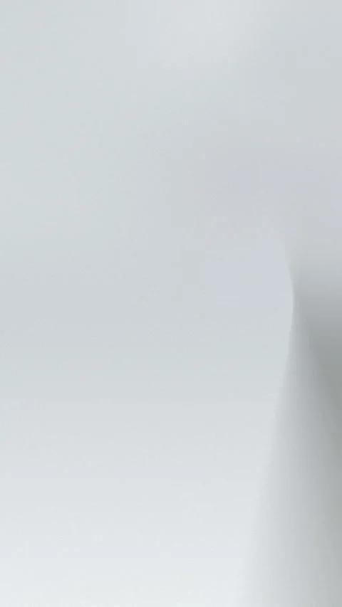 Smooth gray gradient with subtle texture, seamless loop background. 4K. Stockbeeldmateriaal 309956424