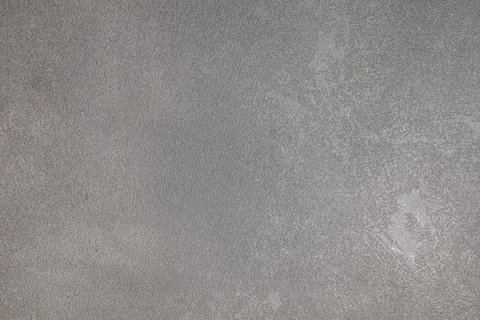 A smooth gray surface with a subtle texture and slight color variations is fe Stock Photos