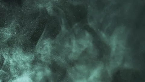 Smooth green dust particles fly in the air in close-up 動画素材 233629228