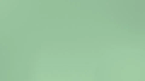 Smooth green gradient with subtle texture. Soft and seamless loop background. Vídeo Stock 309701679