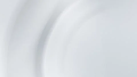 Smooth grey gradient with subtle circular shapes. Seamless loop background. 4K. Stock Footage 299397558