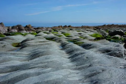 Smooth Grey Rolling Rocks Stock Photos