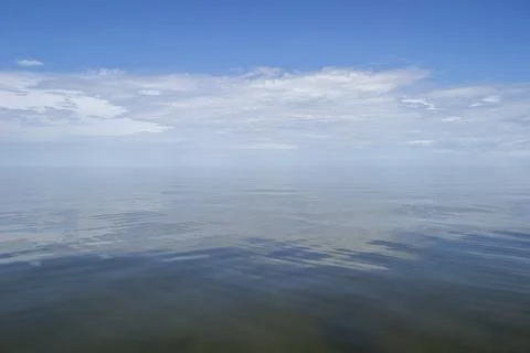 Smooth Gulf Waters with Cloud Reflection Stock Photos