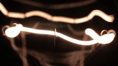 Smooth increase and decrease in the power of the helix of the tungsten filament 库存影片 81087054
