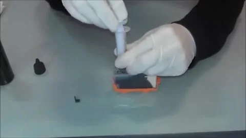 Smooth Ink Injection: Syringe Refills Cartridge with Precision Stock Footage 319981103