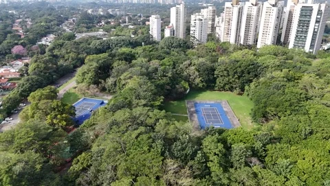 Smooth lateral drone tracking shot revealing the tennis courts of Villa-Lobos Vídeo Stock 340354430
