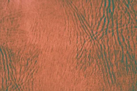 Smooth leather surface, background texture, modified color scheme. Foto stock