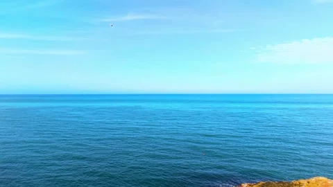 Smooth Left-to-Right Aerial Pan Over the Blue Sea Stock Footage 341866119