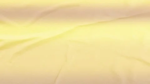 Smooth light yellow silk fabric texture background soft cloth fold banner Stock Footage 340581354