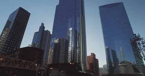 Smooth, low angle tracking shot, taken from a car, as it rides down the Chicago Stock Footage 81881719