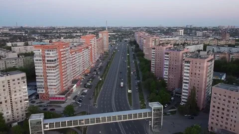 Smooth lowering of the camera over the road and bridge. Final frame for city Stockbeeldmateriaal 131569745