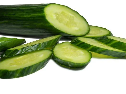 Smooth medium-sized cucumber on a white background. Cucumber slices, isolate. Stock Photos