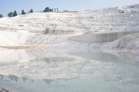 Smooth mirror reflective surface of water in thermal bath travertine terrace Stock Photos
