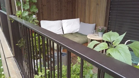 Smooth motion shot of pallet couch on balcony. Stock Footage 109376906