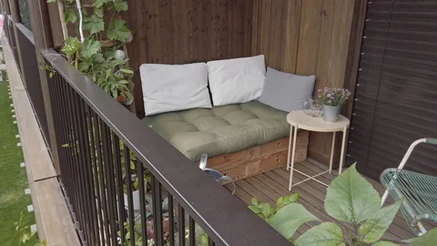 Smooth motion shot of pallet couch on balcony. Stock Footage 109377084