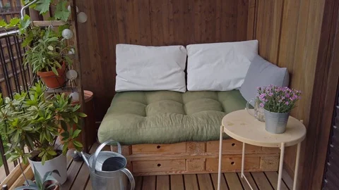 Smooth motion shot of pallet couch on balcony. Stock Footage 109377251