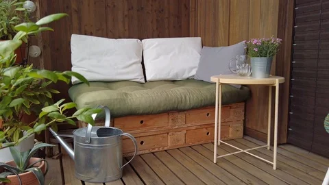 Smooth motion shot of pallet couch on balcony. Stock Footage 109377904