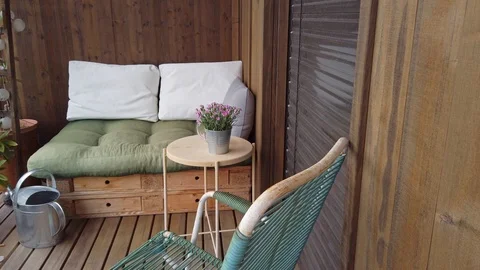 Smooth motion shot of pallet couch on balcony. Stock Footage 109377995