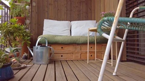 Smooth motion shot of pallet couch on balcony. Stock Footage 109378486
