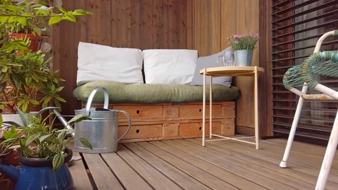 Smooth motion shot of pallet couch on balcony. Stock Footage 109378544