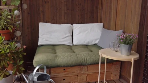Smooth motion shot of pallet couch on balcony. Stock Footage 109379029