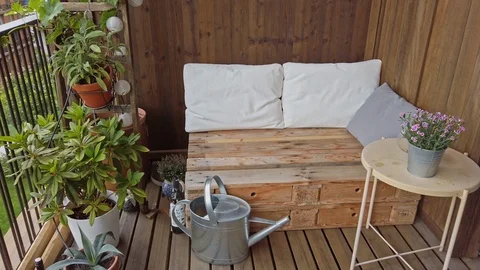 Smooth motion shot of pallet couch on balcony. Stock Footage 109379239