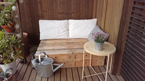 Smooth motion shot of pallet couch on balcony. Stock Footage 109379275
