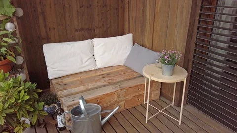 Smooth motion shot of pallet couch on balcony. Stock Footage 109379391