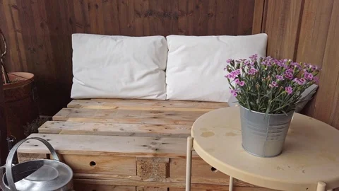 Smooth motion shot of pallet couch on balcony. Stock Footage 109379558