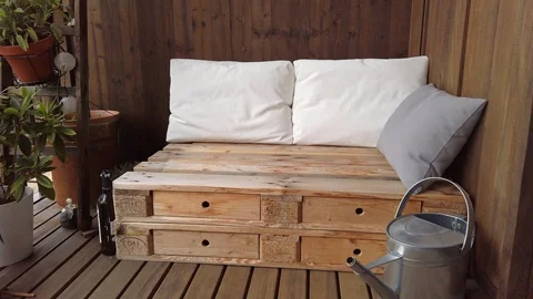 Smooth motion shot of pallet couch on balcony. Stock Footage 109379771